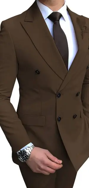 Person wearing brown double-breasted suit with dark tie and luxury diving watch on wrist.