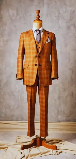 70s men’s bell bottom pants in tan with retro details and flair.