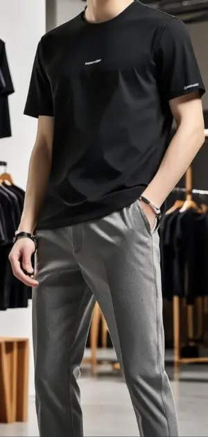 Classic men’s black t-shirt styled with gray trousers for a contemporary outfit.