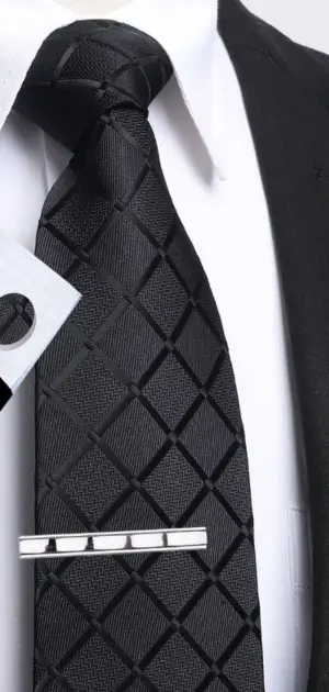 Black tie for men suit featuring a diamond-patterned texture and silver clip, ideal for formal settings.