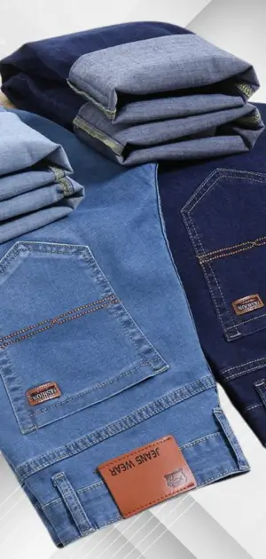 Polyester casual pants for men Stacked polyester jeans for men in various blue shades and styles.