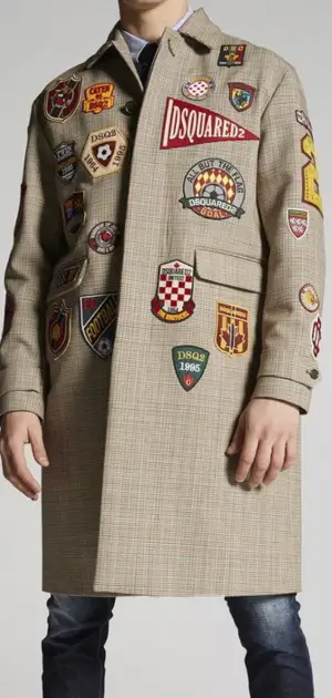 Neutral beige men’s streetwear coat with eye-catching vibrant patches for bold appeal.