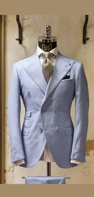 Designs of cotton suits for menLight blue double-breasted cotton formal suit displayed on a mannequin.