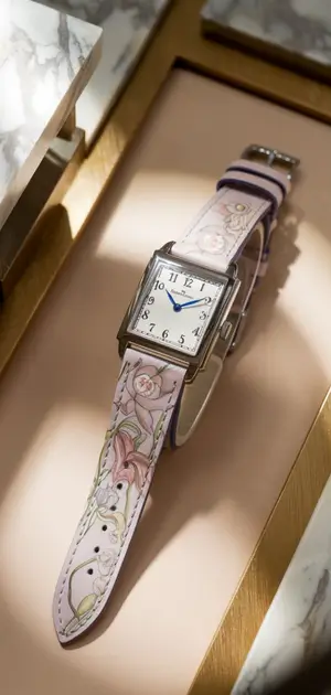 Elegant floral-patterned watch with a square silver case and rose-printed strap