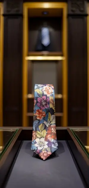 Soft floral tie displayed in a luxurious setting