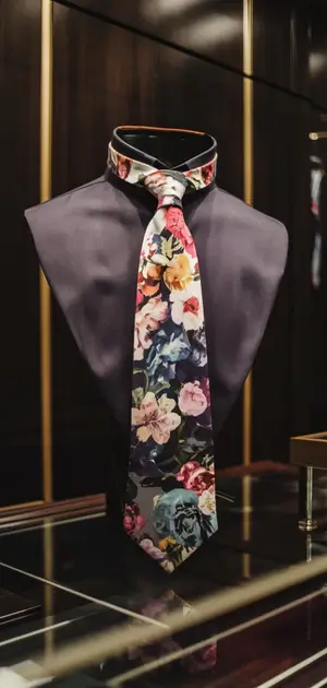 Colorful floral pattern tie on a dark mannequin