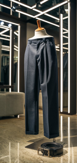 Dark solid jeans paired with accessories on a display stand in a boutique