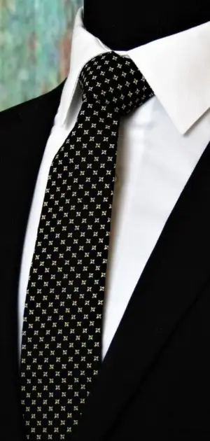 Black tie for men sale featuring a white geometric pattern, ideal for formal and professional wear.