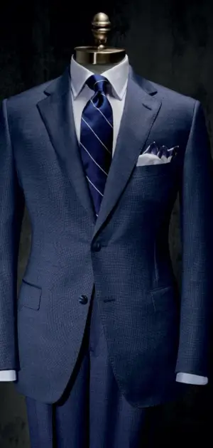 A tailored men’s blue formal suit with a striped tie and pocket square blue colour suit for men.