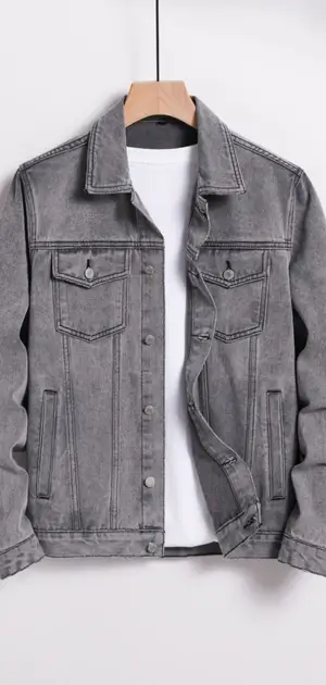 A sleek grey denim jacket featuring minimalist details, styled over a white T-shirt.