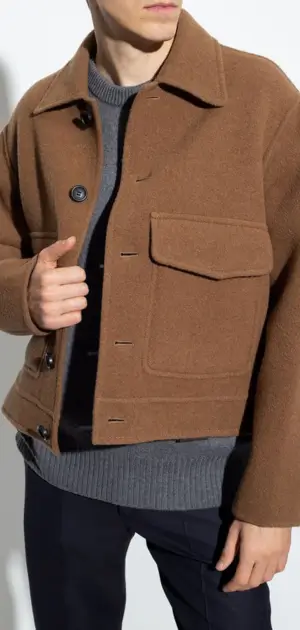 A men’s brown wool jacket styled with a grey sweater for a sophisticated outfit.