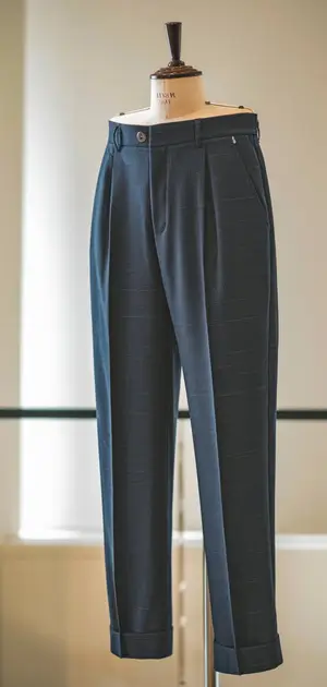 Navy blue mid-range pants on mannequin