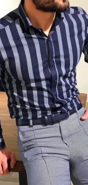Slim-fit modern office pants paired with a navy striped shirt for a stylish look.
