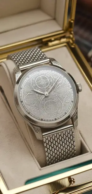 Plaid watch with a silver-tone case and detailed leather strap