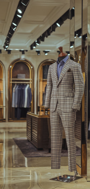 Mannequin in a beige plaid suit in a designer showroom