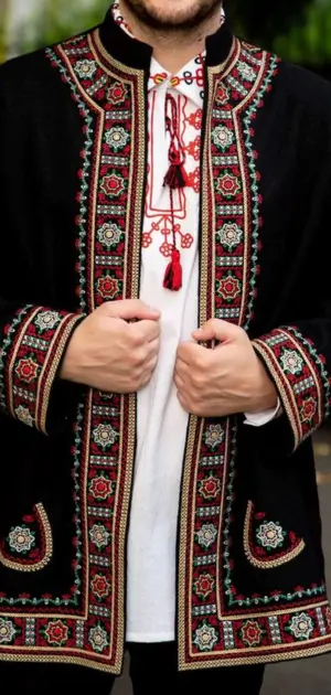 Men’s bohemian coat in black with ornate red and green embroidery and traditional design.