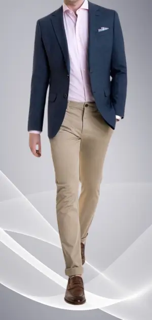 Man wearing a navy blazer, beige trousers, and brown shoes in a men's sports suit.