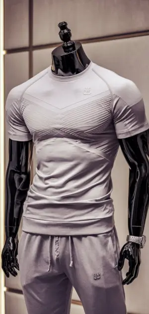 Beige fitted sports t-shirt with embossed patterns and matching joggers