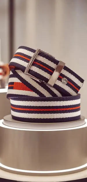 striped belt for men on a classical pedestal