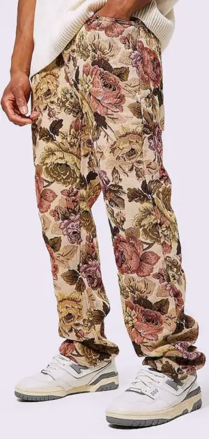 Men’s bohemian jeans featuring bold floral designs and a comfortable relaxed fit.