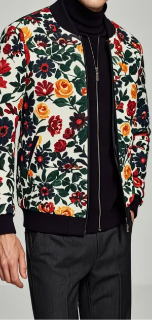 Men’s floral jacket with colorful red and yellow prints, styled over black attire.