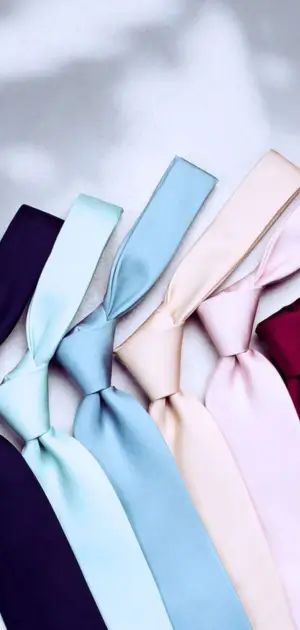 A lineup of pastel bow ties for men in multiple colors suitable for formal or casual wear.