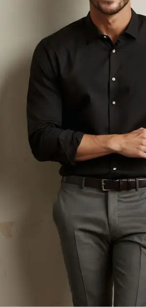 A sophisticated man models a sleek black formal travel shirt, best travel shirt dress for business or leisure travel.