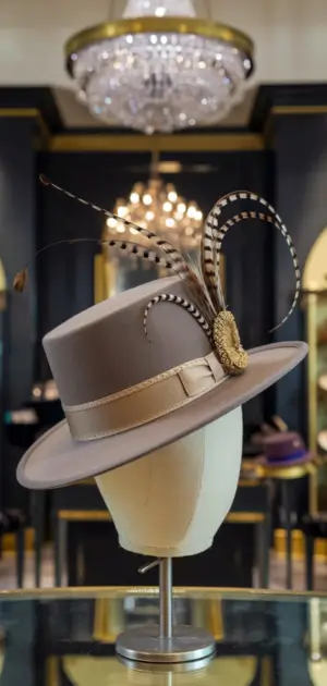 Taupe formal hat with elegant feather design