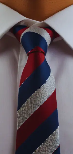 Close-up of a sage green linen tie with a textured finish