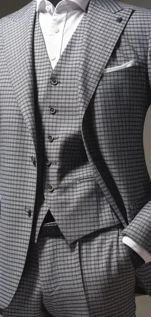 Taupe check suit with blue tie and pocket square
