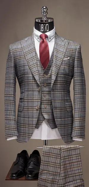 Gray check suit with contrasting buttons and tie