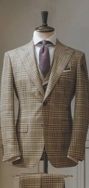 Classy light brown check suit on mannequin