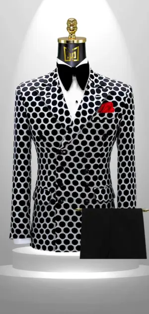 A bold men's blazer featuring black-and-white polka dots styled with a red accent.