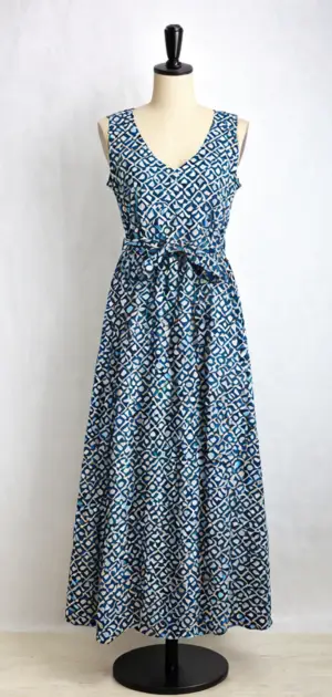 Navy blue sleeveless maxi dress with a patterned belt on a mannequin