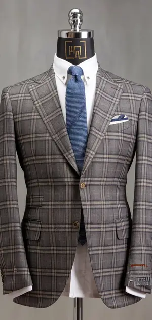 Grey plaid double-breasted suit displayed on mannequin