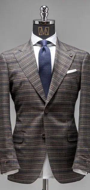 Charcoal grey checked suit on mannequin with blue tie