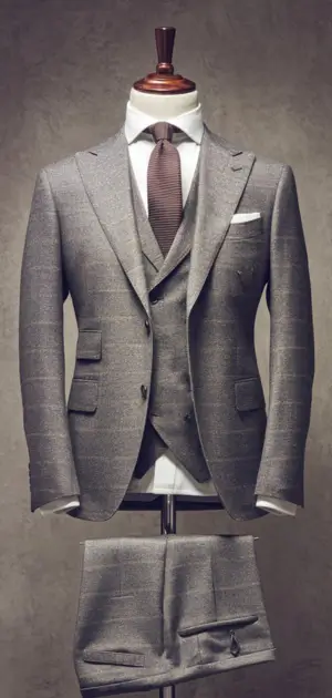 Brown checked suit with wide lapels on mannequin