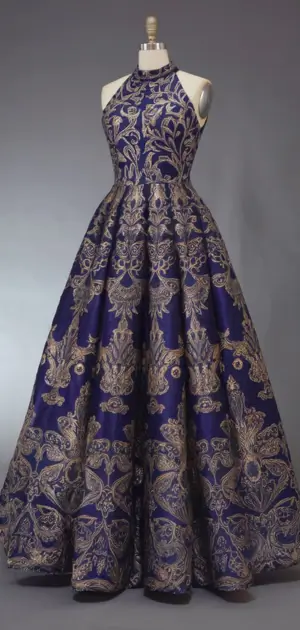 Luxurious purple maxi dress with intricate gold patterns