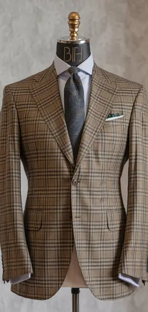 Brown Glen check wool suit on a mannequin