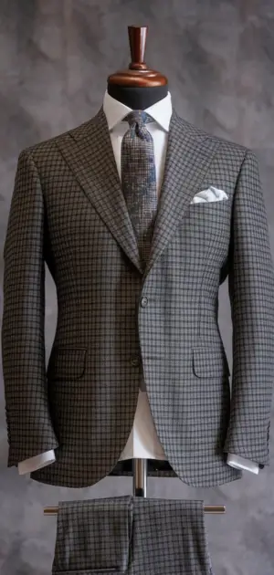 Gray herringbone suit with a patterned tie and pocket square
