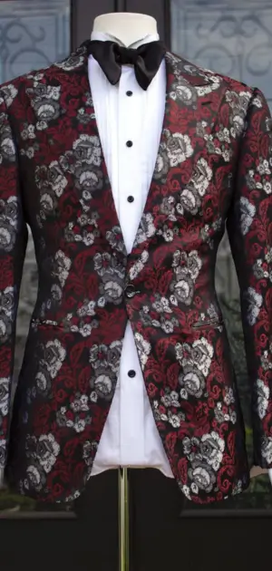 A refined men’s blazer featuring rich red and black floral designs, ideal for standout style.