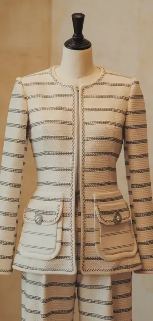 Elegant striped jacket and skirt on a mannequin