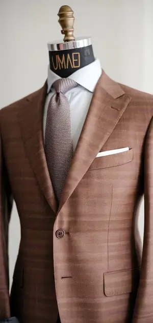 Brown modern fit suit on mannequin