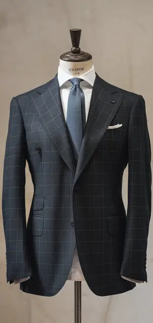 Gray plaid single-breasted suit on display