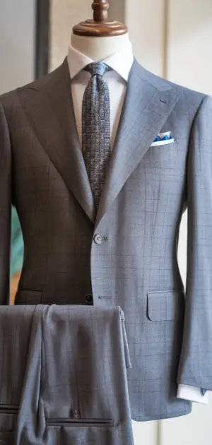 Charcoal grey single-breasted suit displayed elegantly