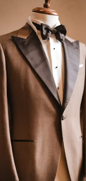 Mannequin displaying a chocolate brown wool tuxedo suit