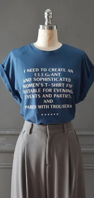 ue T-shirt with text about needing an elegant shirt, paired with grey trousers