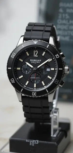 Men’s rubber watch featuring a sleek black dial, silver case, and durable black strap.
