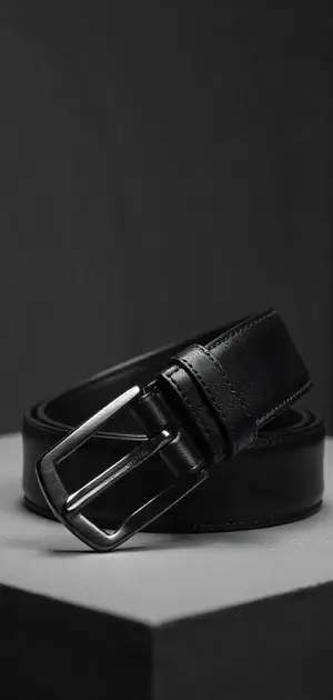 A black leather belt with a polished silver buckle.