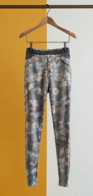 Grey leggings with a subtle floral print and a denim-style waistband.